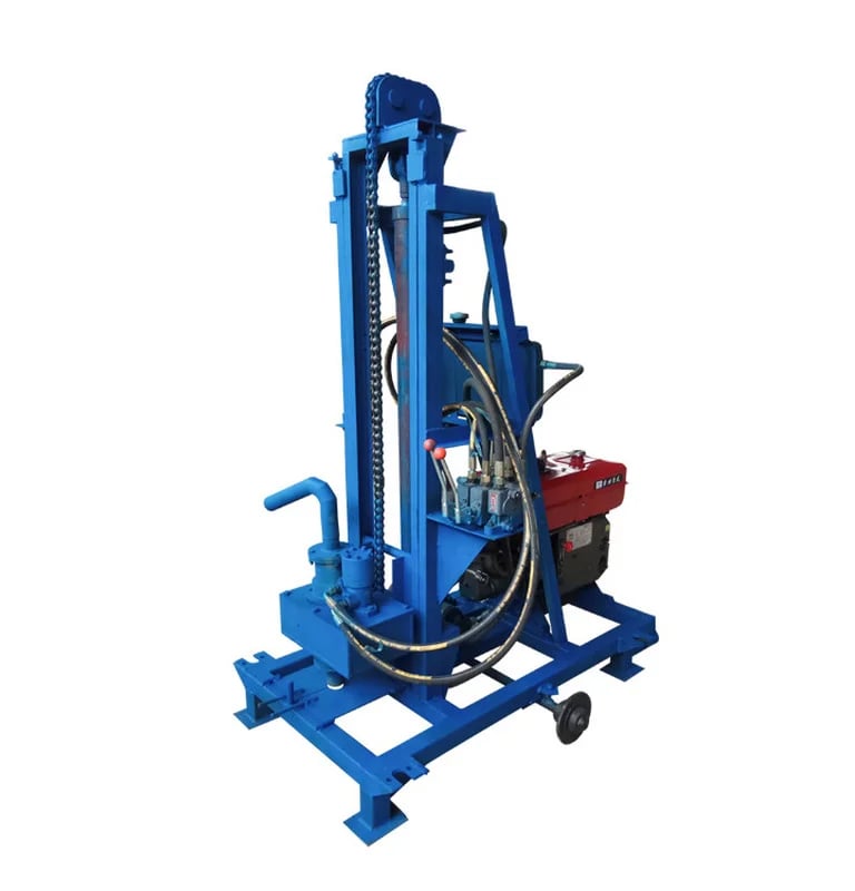 Portable hydraulic water well drilling rig with a blue steel frame and diesel engine.