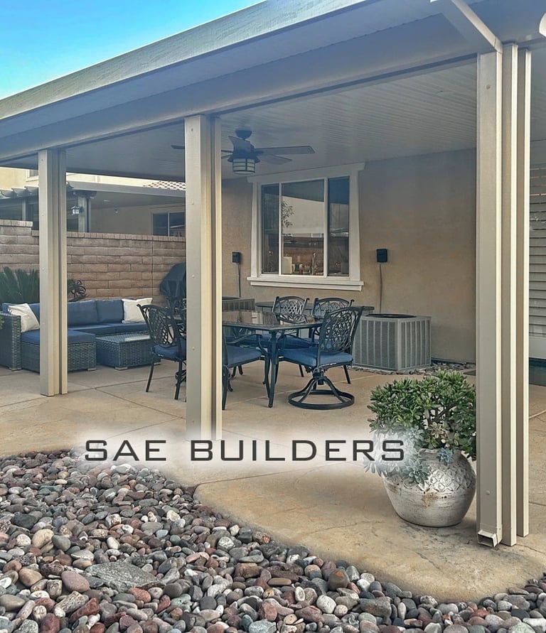 Solid Alumawood patio cover attached to home with ceiling fan. Located in French Valley, California