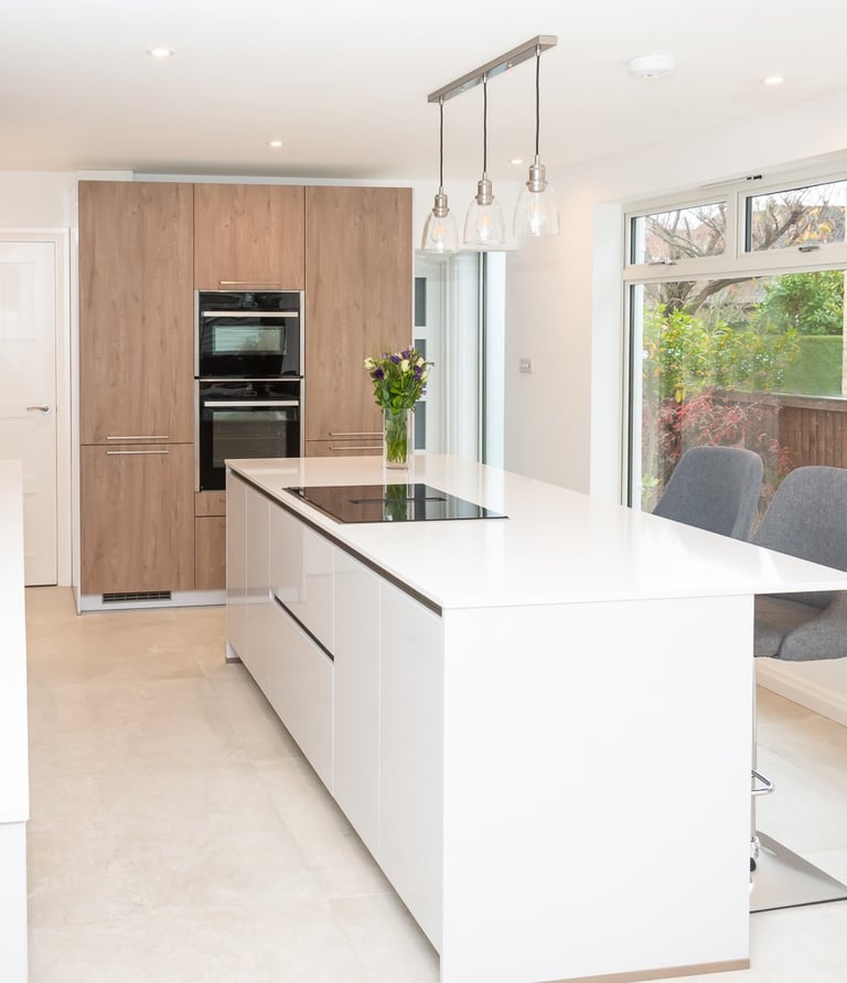 Bauformat white handless kitchen with a mix of wood