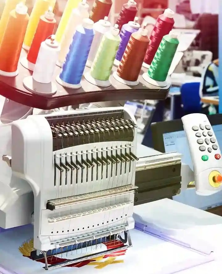 a machine is being used to make a sewing machine