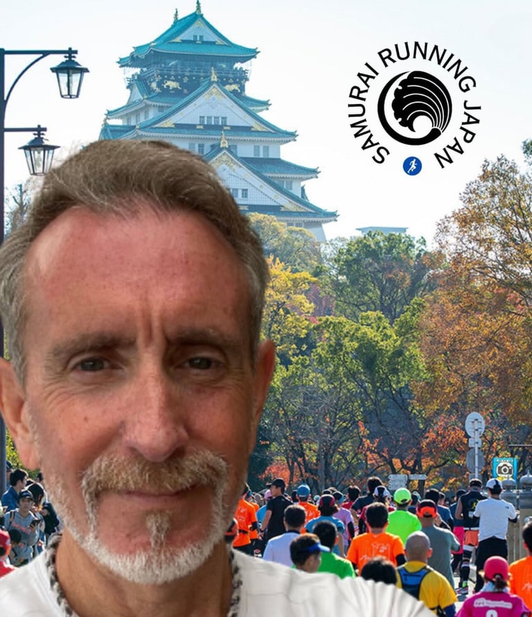 Coach Scott Brown standing in front of an image of runners running the Osaka marathon. Osaka castle.