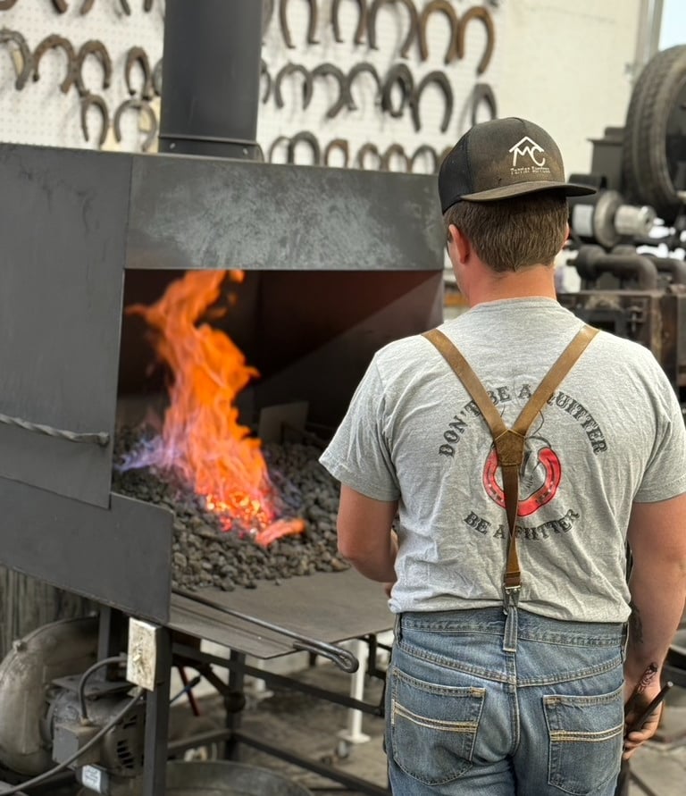 Rafter MC firing a shoe in the forge
