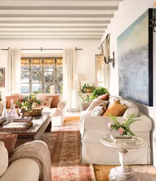 Living room with beams and garden views at Finca Santa Katerina