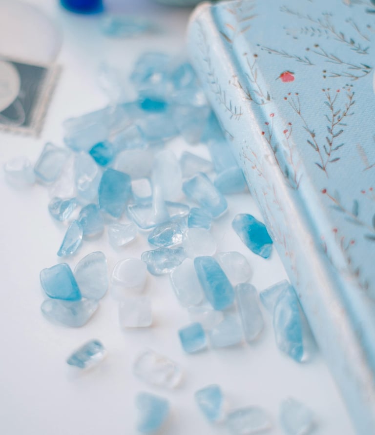 Soothing teal and white sea glass beside faith-based journal for spiritual journaling