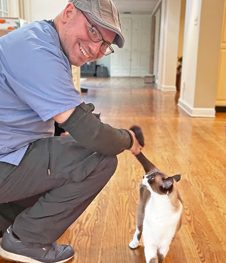 a veterinary and a cat on a hardwood floor