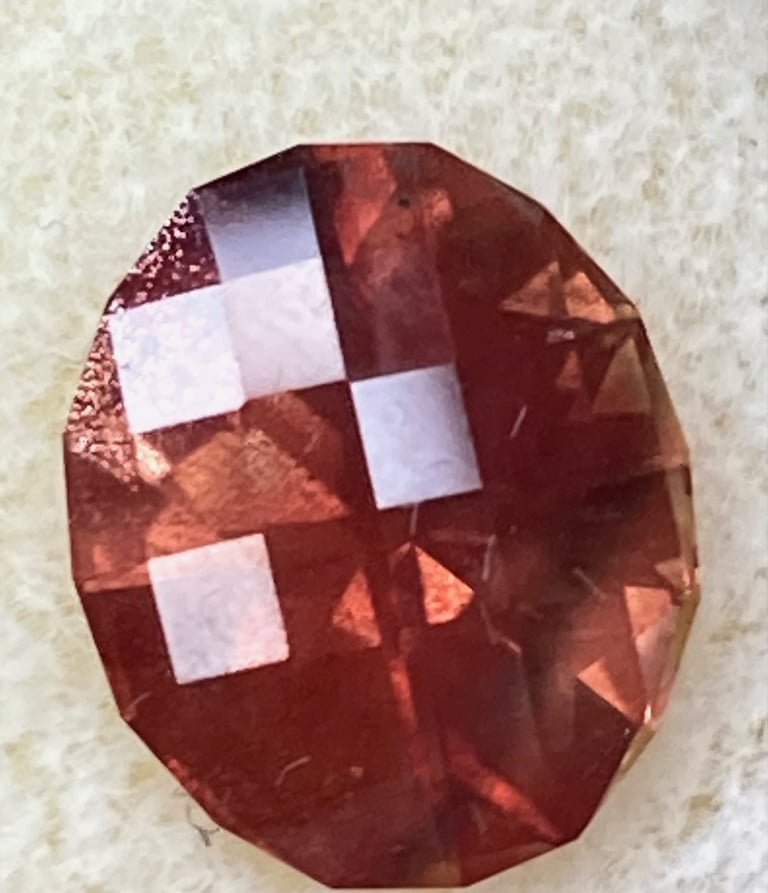 Sunstone with schiller in a checkerboard Oval