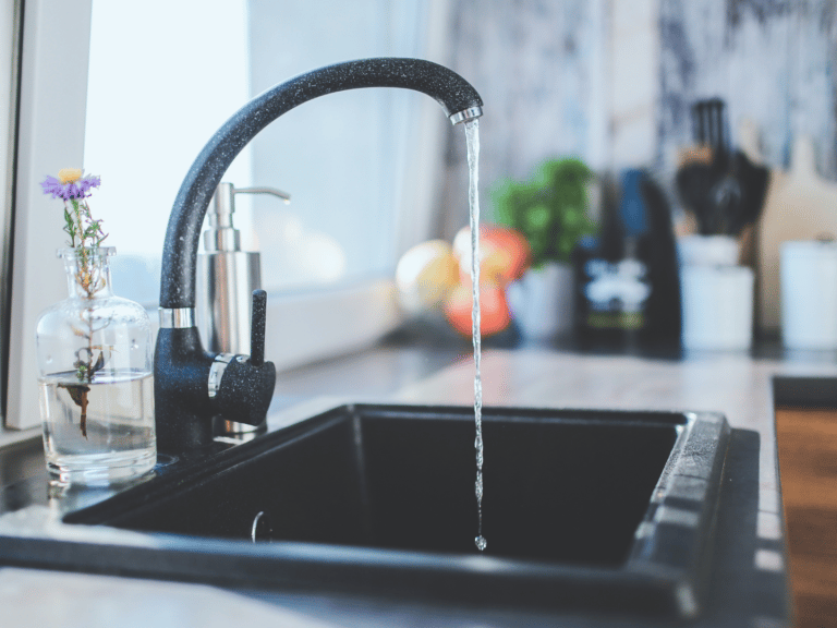 a kitchen sink with a faucet faucet faucet fauce