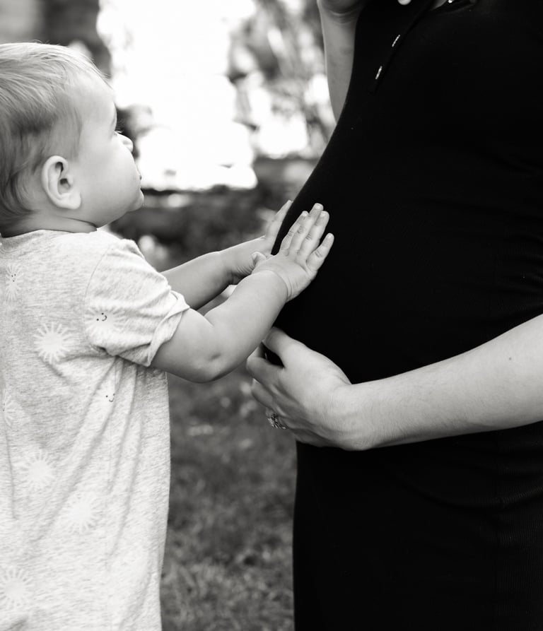 a pregnant woman holding her baby bump bump bump bump bump bump bump bump bump bump