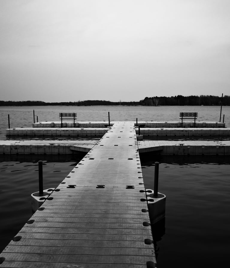a dock with benches and benches in the water