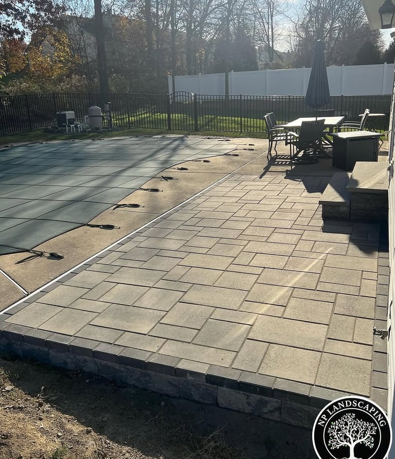 excellent landscaping and hardscaping of grass, stones and trees by NP Landscaping