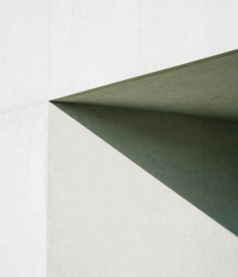 Close-up of a sharp geometric shadow falling on a clean concrete wall, minimalist architectural composition, bright high-contrast natural light, 35mm