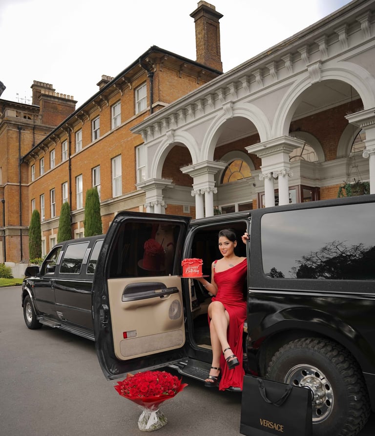 Woman in red dress with limousine and roses, shot by Fred Art Studio