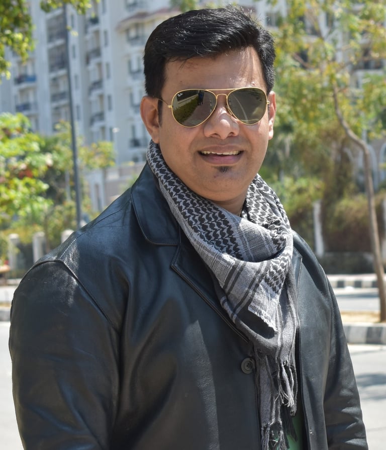 a man in a black jacket and sunglasses, raheel ahmed