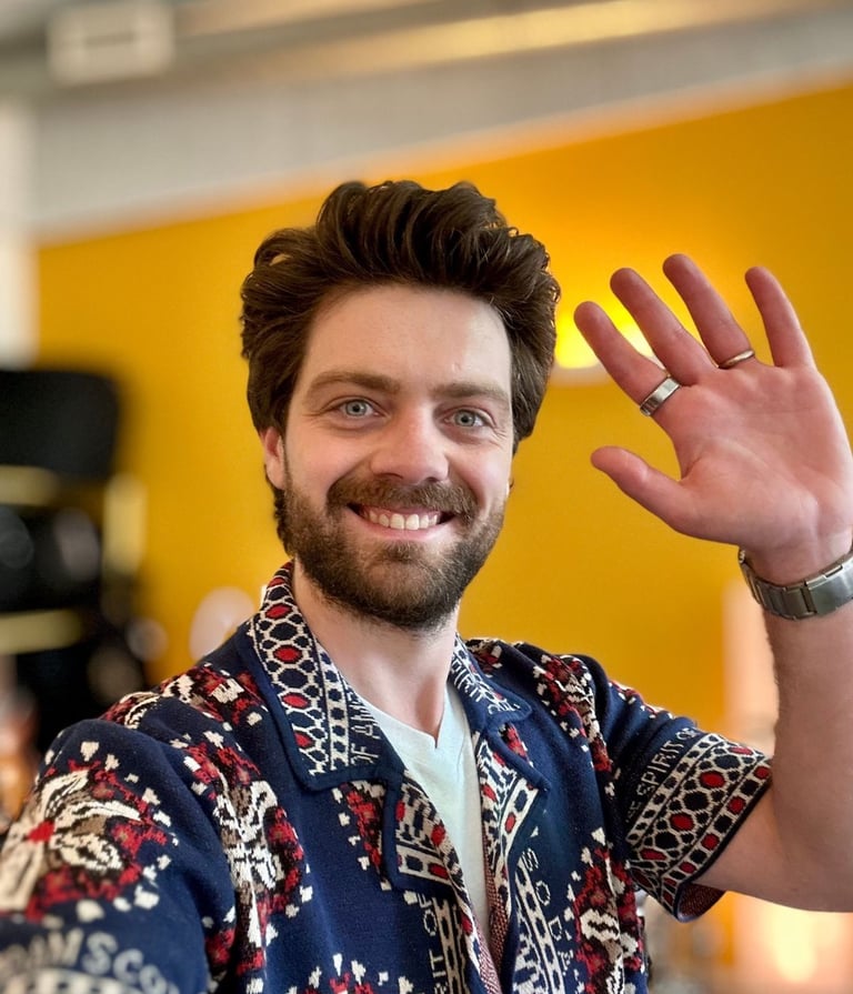 a man with a beard and a ring on his finger