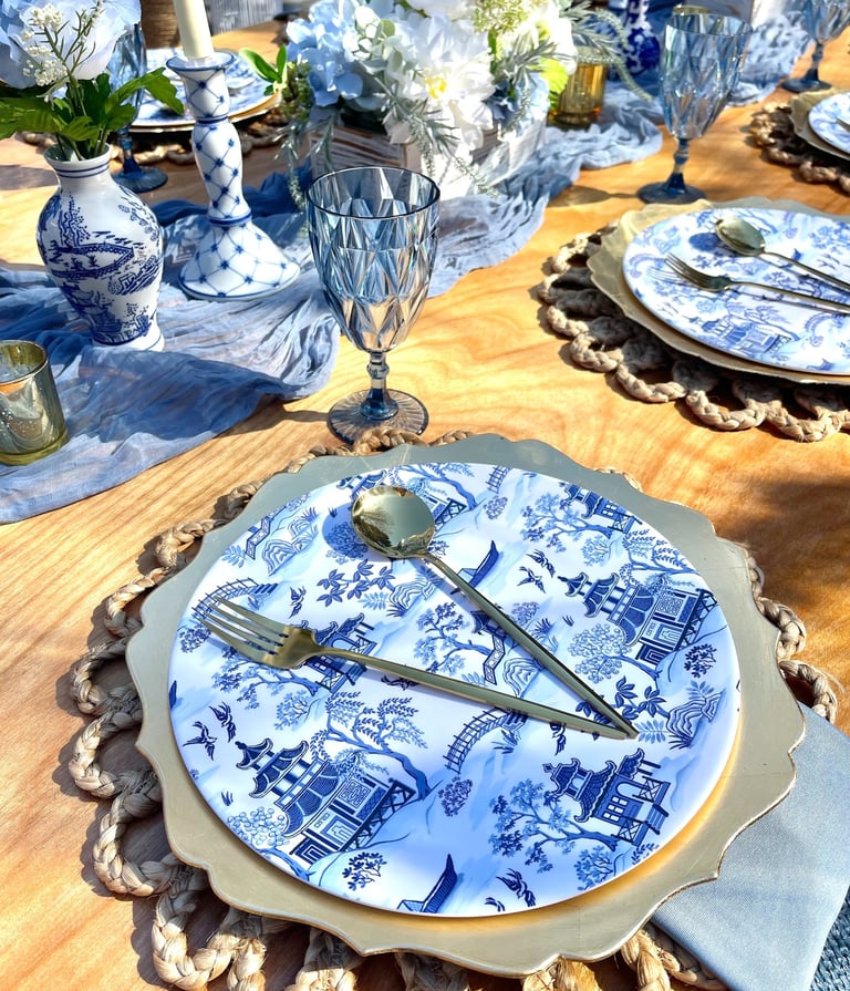 Blue Willow place setting, gold flatware, elegant outdoor luxury picnic Gathered Grace Picnic Co