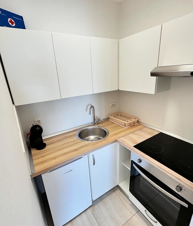 Kitchen with coffe machine and cooking space