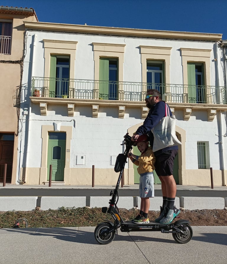 Trotinette users by the side of the canal