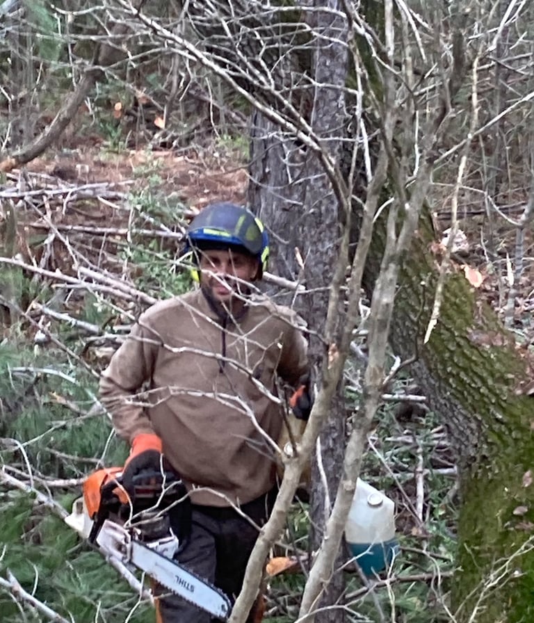 One of the team with his chainsaw