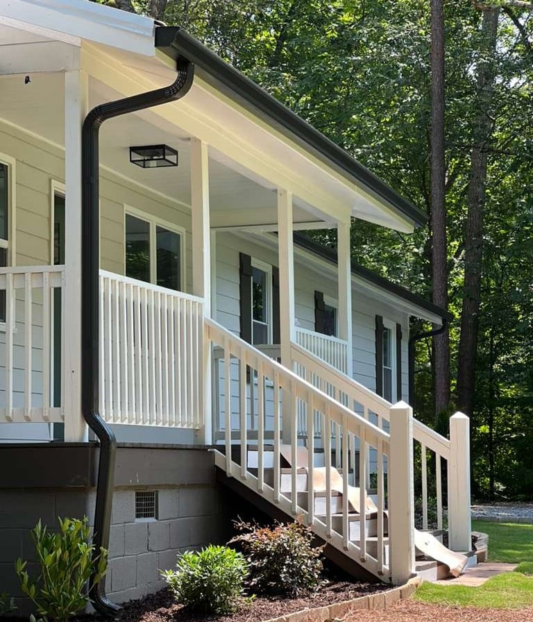 Professional seamless aluminum gutter installation.