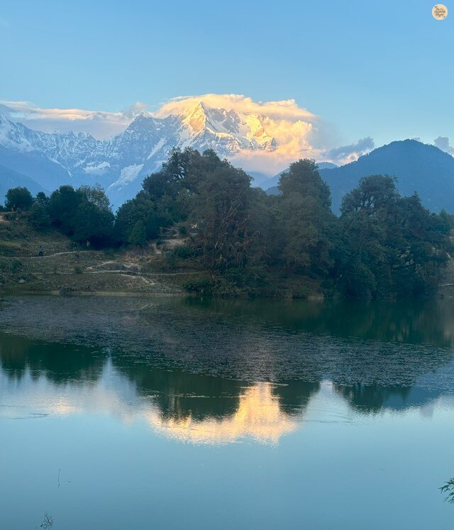 Deoria Tal reflecting Chaukhamba and Himalayan peaks, Uttarakhand, serene alpine lake.