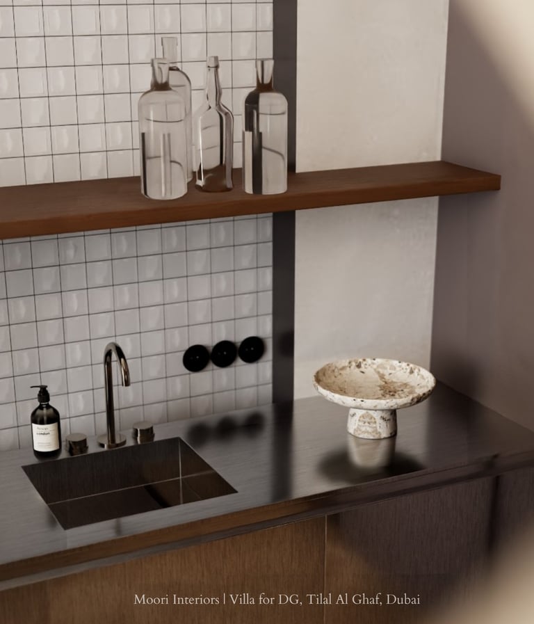 Modern sink area with a stainless steel countertop, white tiled backsplash, and a decorative bowl.