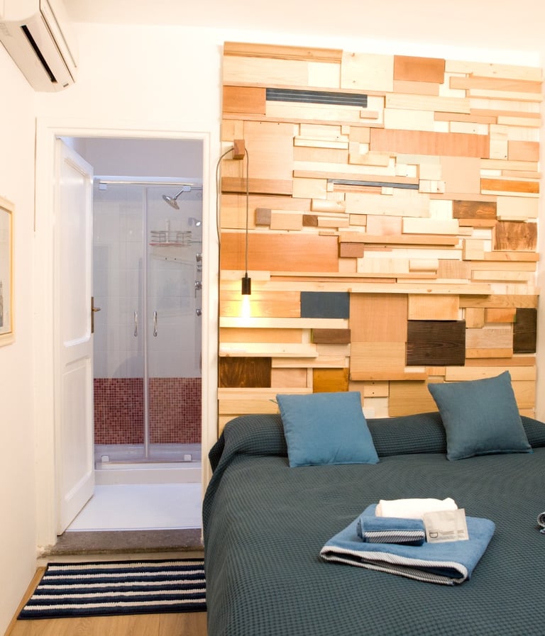 Bedroom and private bathroom  at Studio Paolina 2   rental short stay home in Rome city center