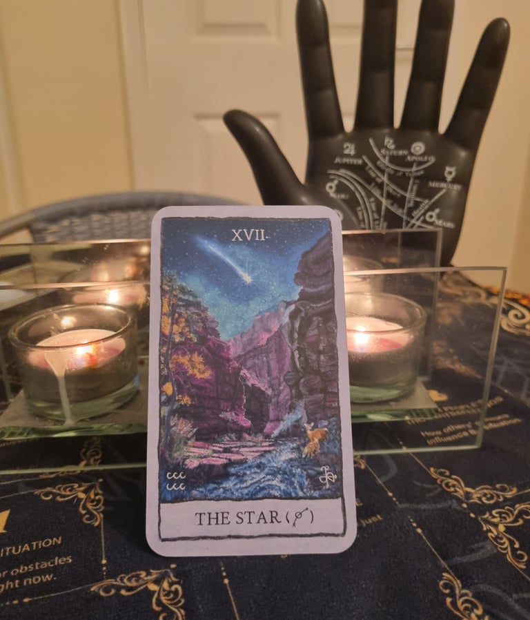 the star tarot card, ornamental hand, candles