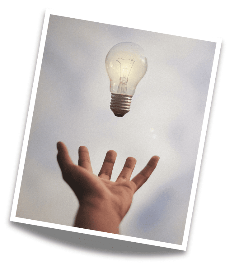 inspirational photo of a hand and a light bulb