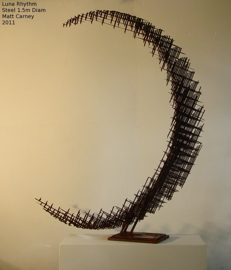 a steel cross-hatched crescent shaped sculpture
