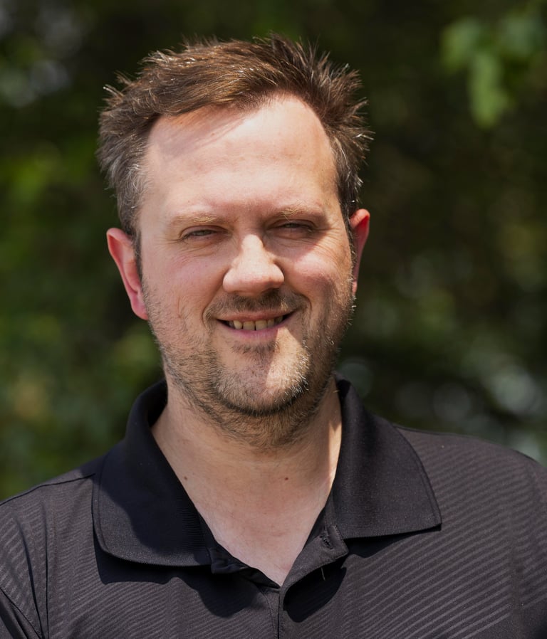 a man with a beard and a black shirt