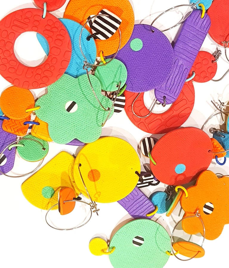 bright coloured earrings in a pile