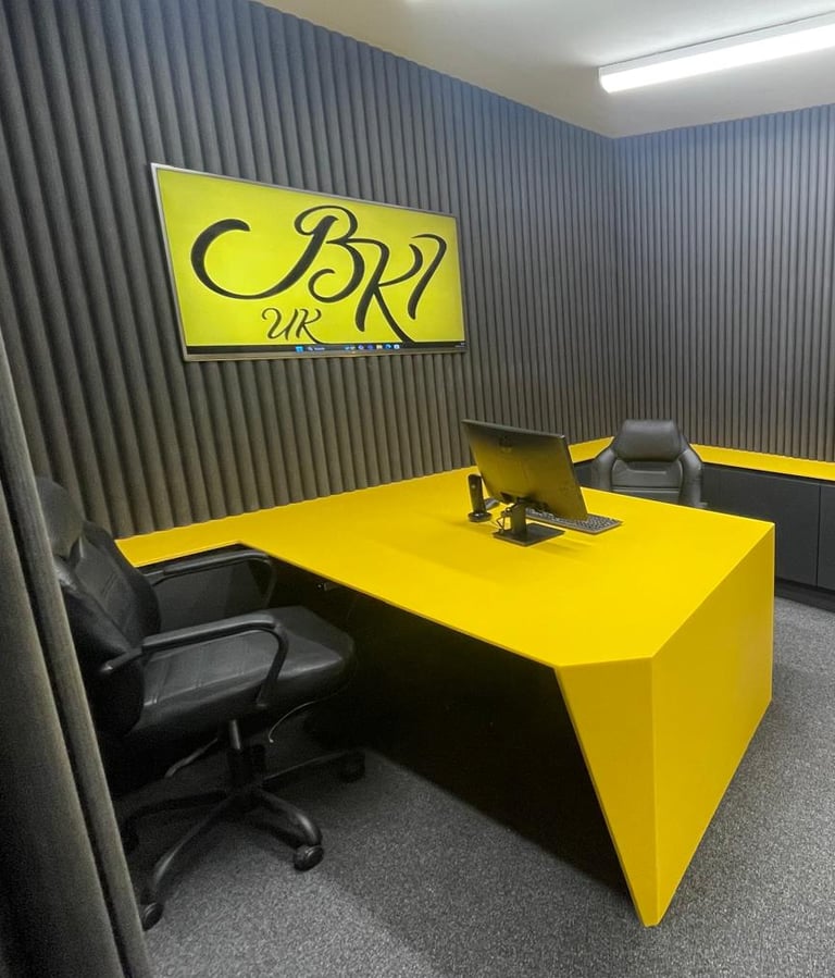 A modern office with sleek HIMACS surfaces and curved acoustic walls, blending style and function.