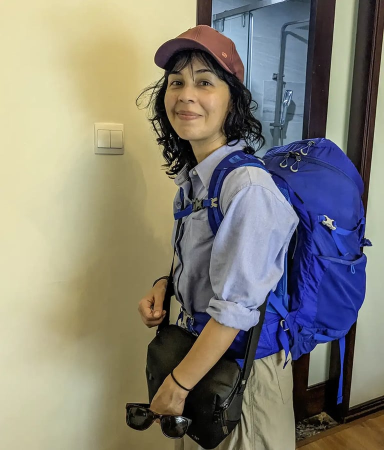 Person wearing backpack before leaving Hoi An, Vietnam