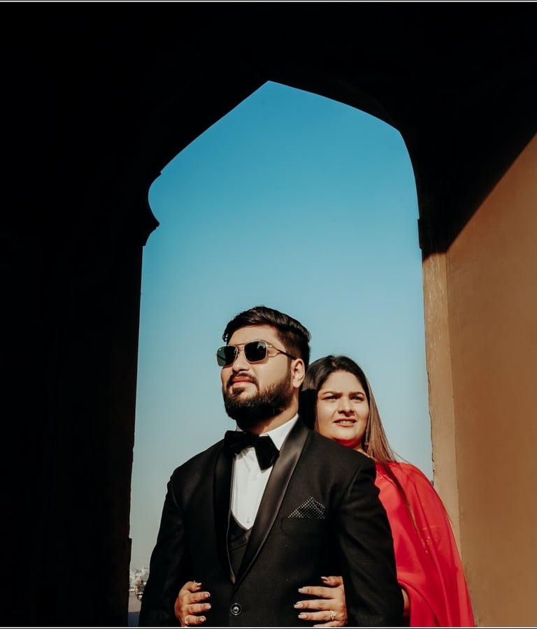 Couple posing in a rustic setting for their pre wedding photo