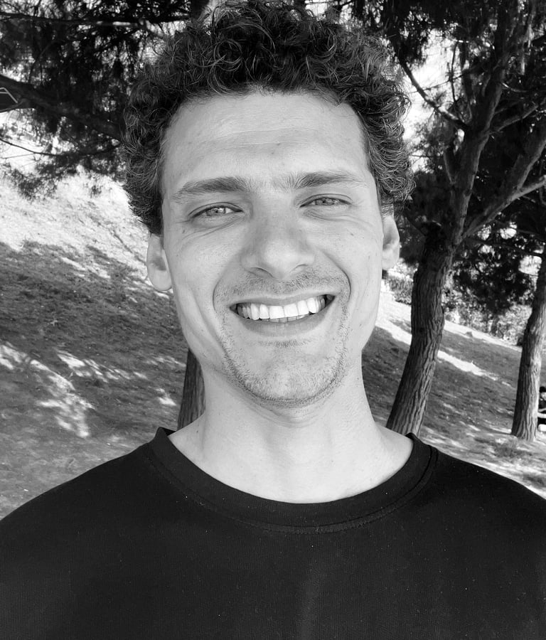 Aybars Düzey, Tai Ji and Qi Gong instructor at WDP Türkiye, smiling outdoors in natural light.