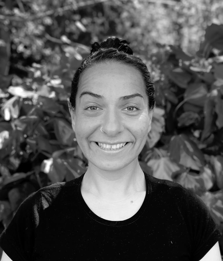Ebru Tütek, Tai Ji and Qi Gong instructor at WDP Türkiye, smiling outdoors in a forest setting.