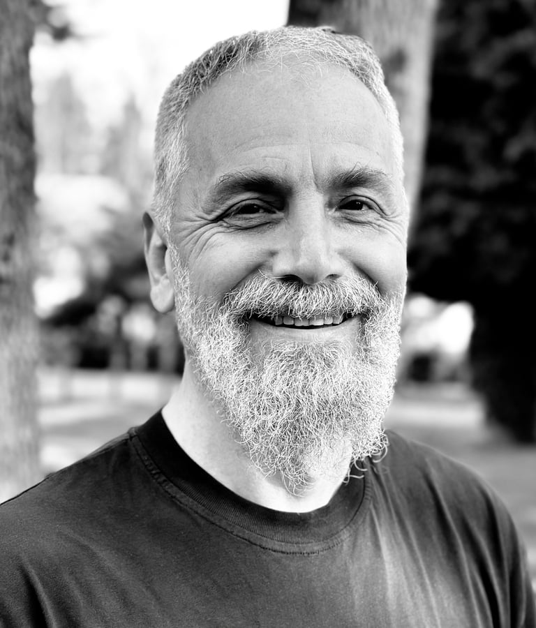 Harun Mehmet Soydan Tai Ji Qi Gong senior instructor of WDP Turkey, smiling outdoors in black shirt