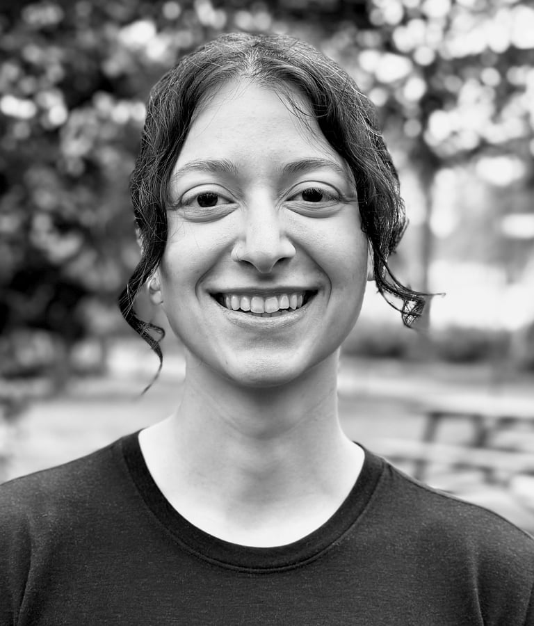 Zeyneb Önsiper Tai Ji Qi Gong instructor of WDP Turkey, smiling outdoors in black shirt