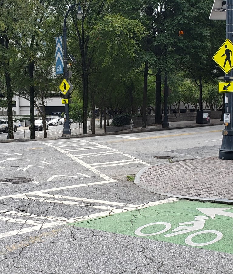 Two-stage bicycle turn queue box with crosswalk and RRFB