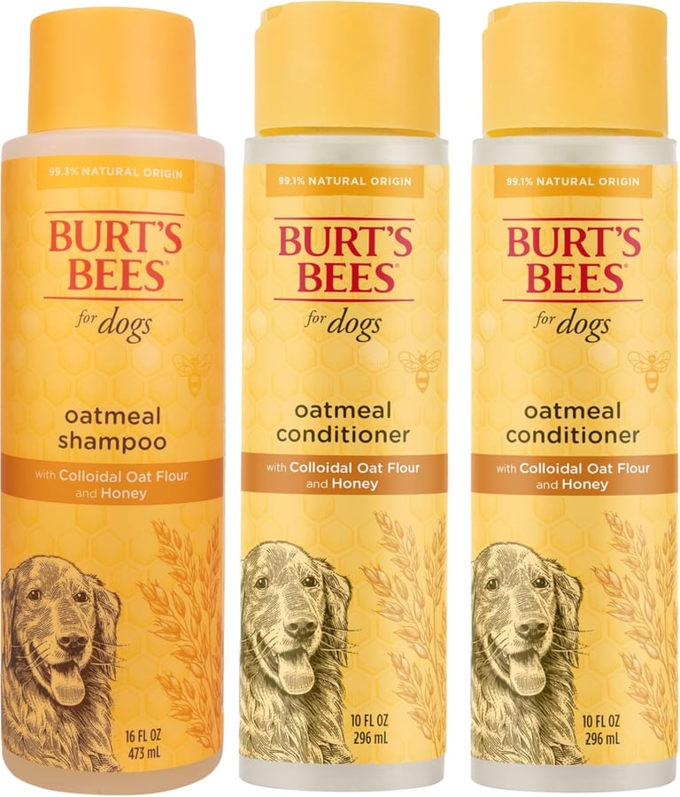 Three bottles of Burt's Bees for Dogs oatmeal shampoo and conditioner with colloidal oat flour and honey.
