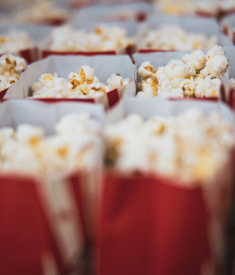 Rows of movie popcorn in red bags 