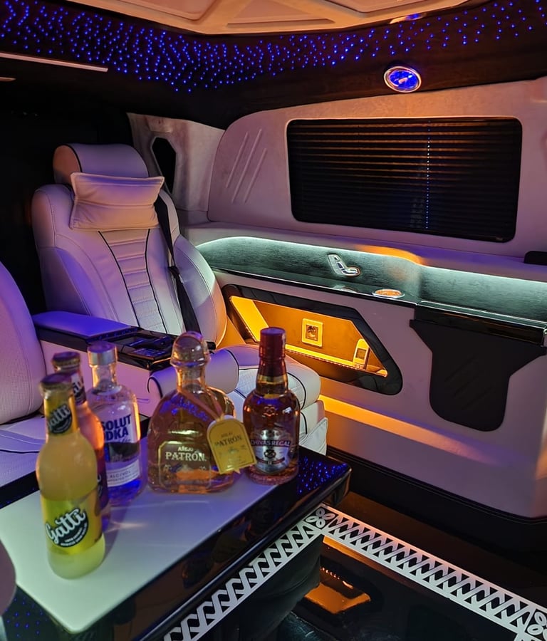 Luxury Transfer Van Interior With Premium Seating And Refreshments