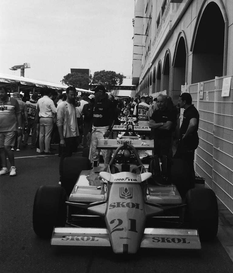 a race car parked in the paddock