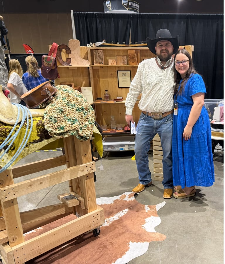 EJ Leather, LLC craftsman at booth showcasing handmade leather goods