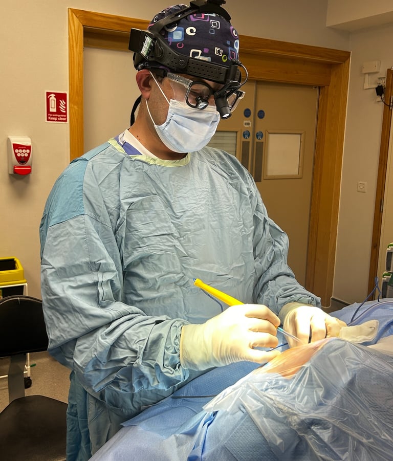a man in a surgical gown is performing a surgery procedure