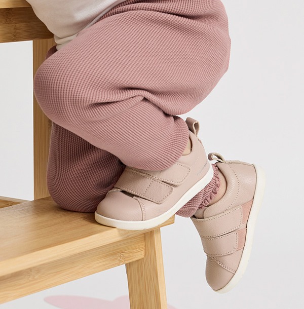 Fashion campaign photography - baby's feet on a wooden chair