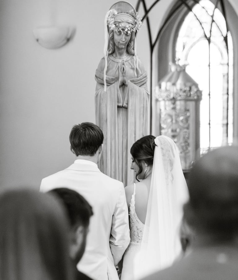 black and white photo, flowers for Mary, Catholic wedding ceremony