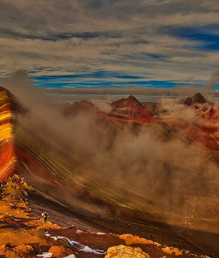 This image shows Vinicunca, the Rainbow Mountain or Mountain of Seven Colors, in Peru’s Andes famed for vibrant stripes.