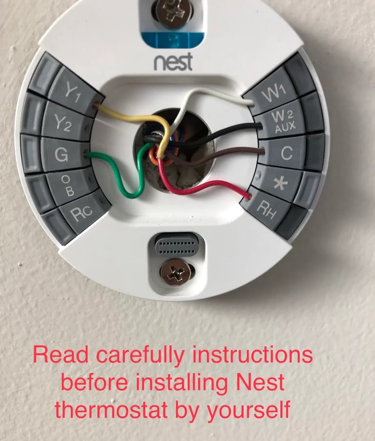 Nest Thermostat Installation photo with message in red to read instructions before installing thermostat by yourself
