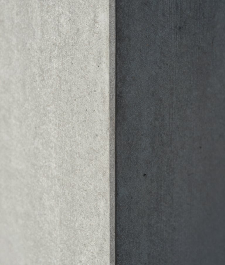 Close-up macro photography of a concrete pillar texture meeting a sharp metal edge, architectural detail, soft shadows, light gray and medium gray tones, editorial style, North American / European.